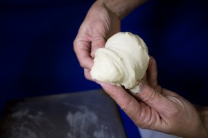 Forming the roll: Second, pull the top part of the dough. 