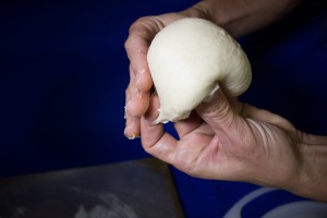 Forming the roll: Third, pinch the dough on the bottom. 
